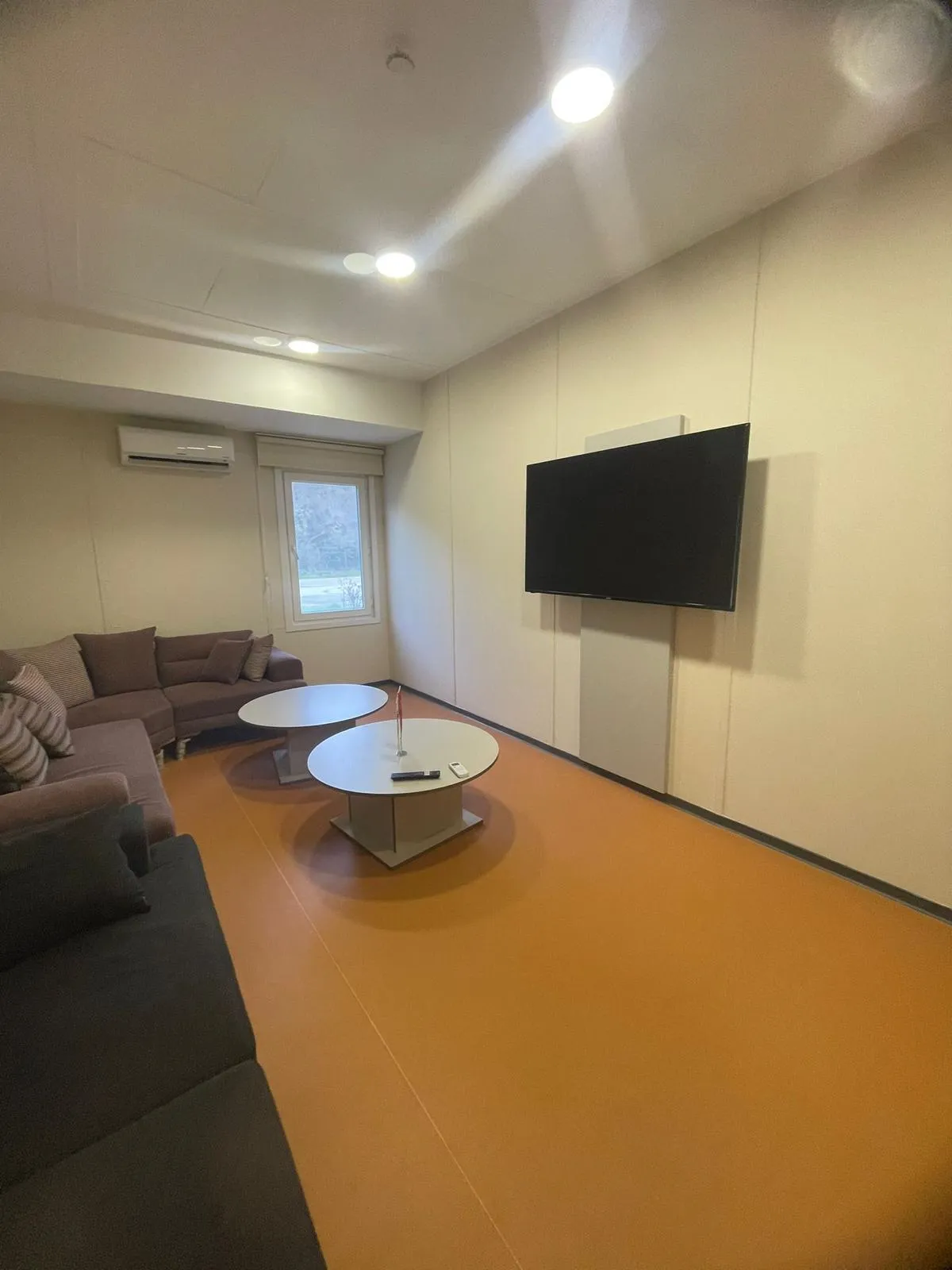 Equipped female student room with bed and wardrobe – dormitory near universities